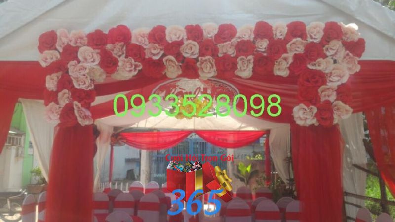 Cổng cưới hoa giấy tông đỏ tươi  CHG31 : Mẫu cưới hỏi trọn gói 365 của công ty dịch vụ trang trí nhà tiệc cưới hỏi đẹp rẻ uy tín ở tại quận Tân Phú Sài Gòn TPHCM Gò Vấp