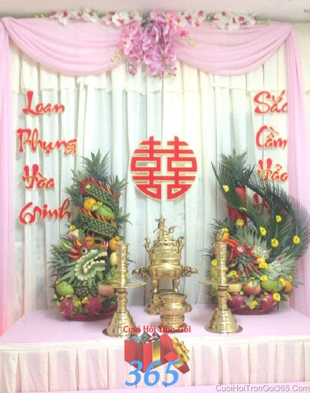 Trang trí bàn thờ tổ tiên tông hồng phấn trang trọng với cặp rồng phụng trái cây cho lễ cưới BT22 : Mẫu cưới hỏi trọn gói 365 của công ty dịch vụ trang trí nhà tiệc cưới hỏi đẹp rẻ uy tín ở tại quận Tân Phú Sài Gòn TPHCM Gò Vấp